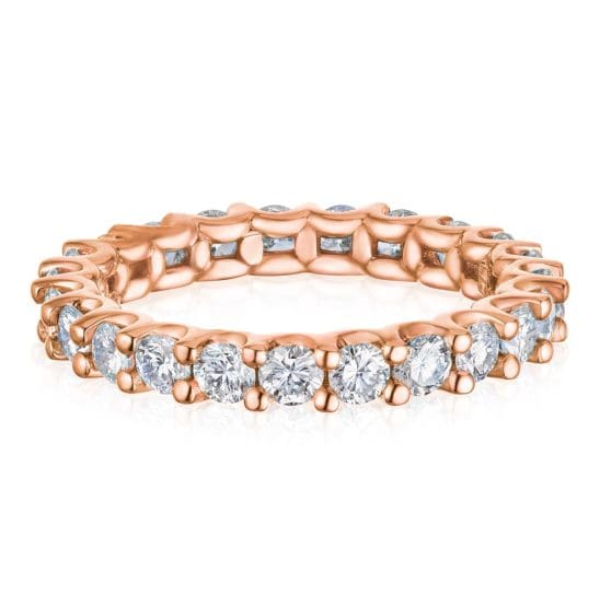 Chic Pink Gold Ring Adorned with White Gems All Around White Background Jewelry Product Photography
