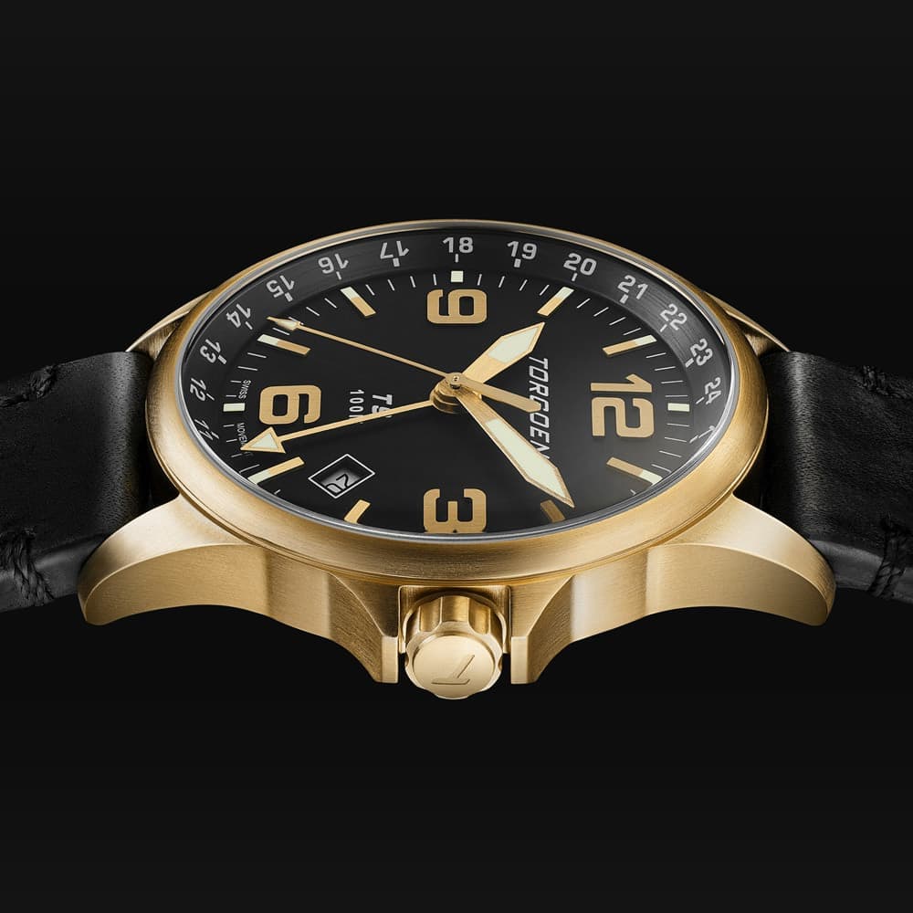 Classic gold watch with an elegant black strap on a sleek black background shines in packshot ecommerce After