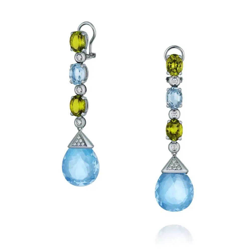 Elegant Silver Earrings on a Pristine White Background Featuring Blue and Green Gemstones Professional Jewelry Photography before