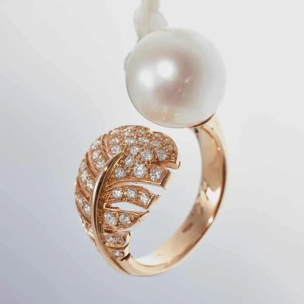 Pink gold open Ring with pearl and feather in product photos white background capturing lifestyle jewelry photography allure before