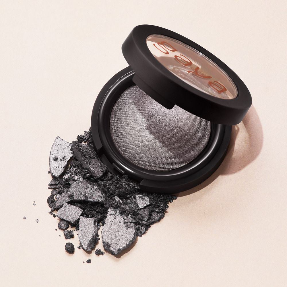 Shattered grey eyeshadow blends makeup cosmetics photography with product photography with white background allure