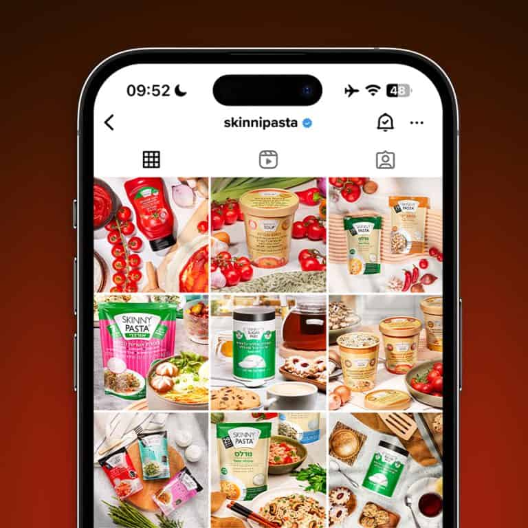 Smartphone with Instagram feed for weight loss brand in appealing reds in lifestyle product photography services
